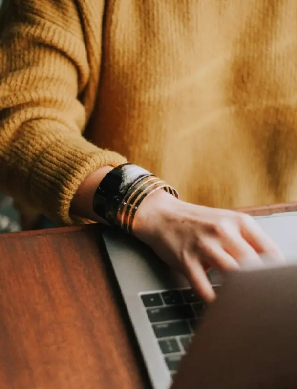 Remote worker using a laptop in a stylish kitchen
