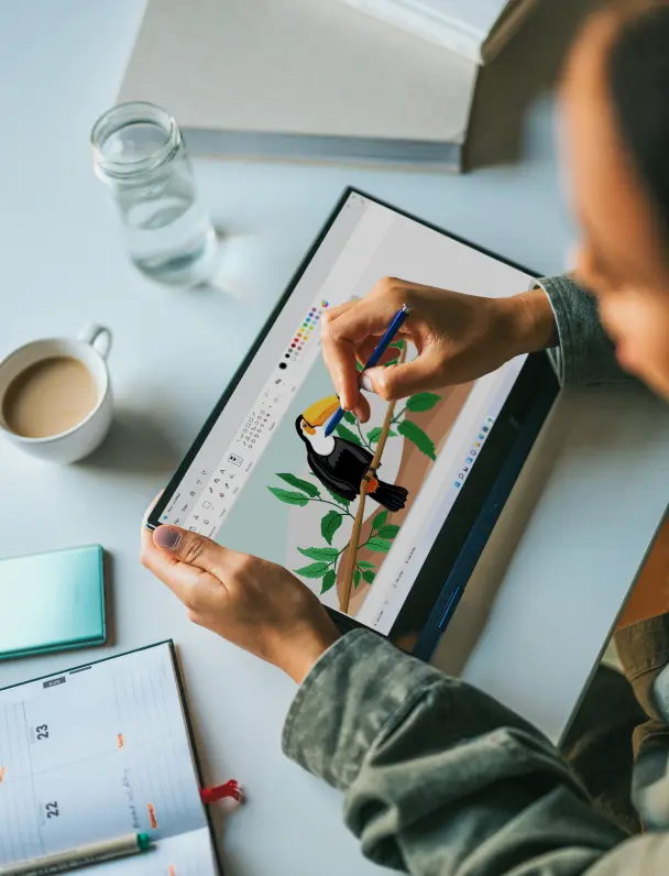 Focused professional typing on a tablet in a warm, well-lit room